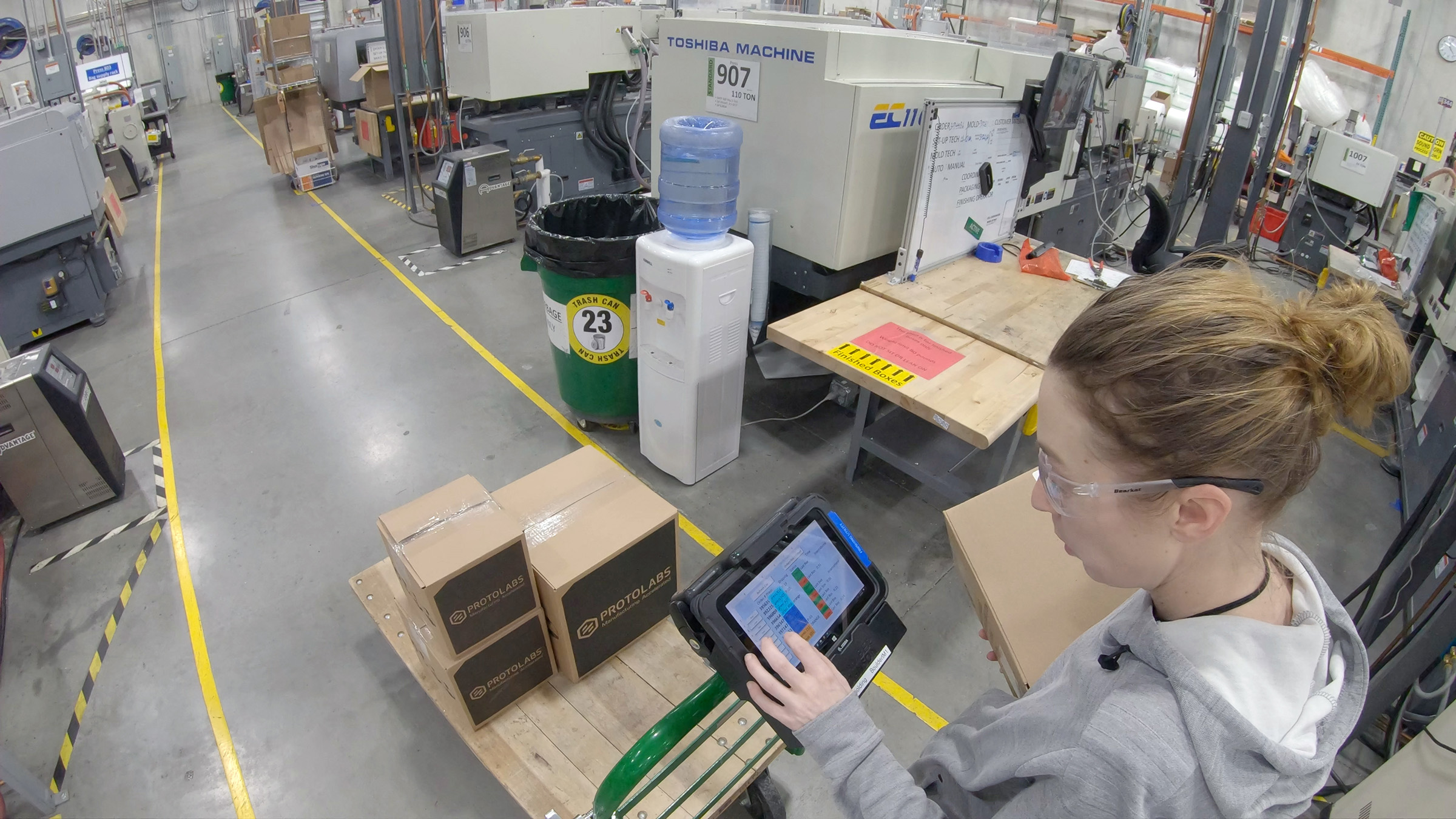 Electronics manufacturing line with automated quality-control equipment and production monitoring