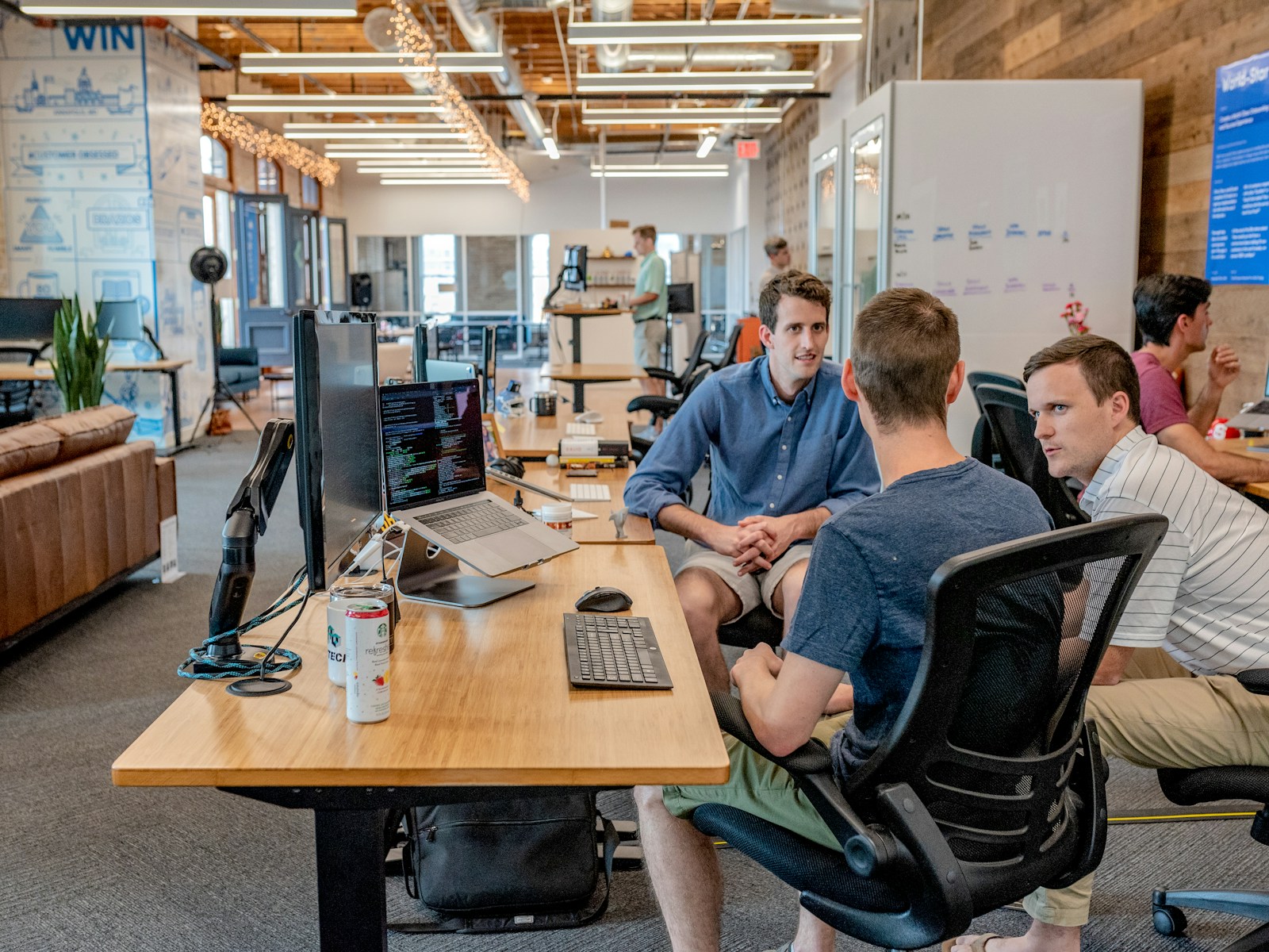 A small business team discussing a sales process around a table